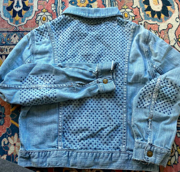 jean jacket decorated in sashiko